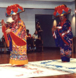 Okinawan dancers in colourful costumes.